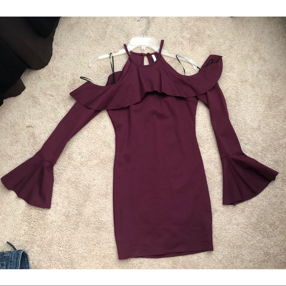 Party cocktail dress with cut out shoulders.